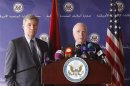 U.S. Senator John McCain speaks during a news conference next to with Senator Sheldon Whitehouse after his meeting with Libyan officials in Tripoli