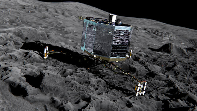 This artist impression  from  Dec. 2013  by ESA /ATG medialab ,  publicly provided by the European Space Agency,  ESA, shows Rosetta's lander Philae (front view) on the surface of comet 67P/Churyumov-Gerasimenko. The comet lander Philae has awakened from a seven-month hibernation and managed to communicate with Earth for more than a minute, the European Space Agency said Sunday June 14, 2015. The probe became the first spacecraft to land on a comet when it touched down on the icy surface of 67P/Churyumov-Gerasimenko in November. Shortly after its historic landing, Philae managed to conduct experiments and send data to Earth for about 60 hours before its batteries were depleted and it was forced into hibernation. (ESA/ATG medialab/ESA  via AP)