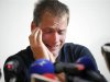 Former 50 km race walk 2008 Olympic gold medallist Alex Schwazer of Italy reacts as he holds a news conference in Bolzano