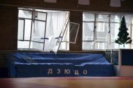 Broken windows and debris are seen inside a sports hall following sightings of a falling object in the sky in the Urals city of Chelyabinsk February 15, 2013. REUTERS/OOO Spetszakaz