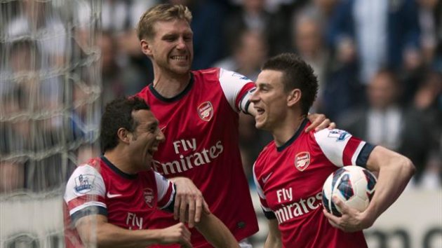Arsenal's Lourent Koscielny celebrates with his team mates after scoring his sides first goal of the game (PA Photos)
