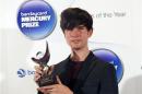 Musician James Blake, winner of the 2013 Mercury Music Prize, poses for a photograph after the ceremony in north London