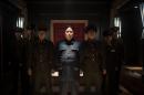 This photo provided by Columbia Pictures - Sony shows, Randall Park, center, as North Korean leader Kim Jong Un in Columbia Pictures' "The Interview." North Korea has been linked to the unprecedented act of cyberwarfare against Sony Pictures that exposed tens of thousands of sensitive documents and escalated to threats of terrorist attacks that ultimately drove the studio to cancel all release plans for "The Interview." (AP Photo/Columbia Pictures - Sony, Ed Araquel)