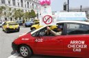 San Francisco taxi driver Joel Sanchez shows his opposition to Lyft, one of the ride sharing programs taxi drivers say is operating illegally in San Francisco