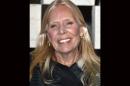 FILE - Joni Mitchell arrives to the Hammer Museum's "Gala In The Garden" in this Saturday, Oct. 11, 2014 file photo taken in Los Angeles. Mitchell was hospitalized in Los Angeles on Tuesday, March 31, 2015 according to the Twitter account and website of the folk singer and Rock and Roll Hall of Famer, but details on her condition have not been released. (Photo by John Shearer/Invision/AP, File)