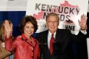 US Senate Republican Leader Mitch McConnell and his wife Elaine Chao wave to supporters after a victory celebration following McConnell's victory in the state Republican primary May 20, 2014 in Louisville, Kentucky