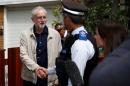Britain's opposition Labour Party leader Jeremy Corbyn leaves his home in London