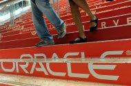 Attendees walk down branded steps at the 29th Oracle OpenWorld in San Francisco October 2, 2011. REUTERS/Susana Bates