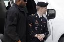 Army Pfc. Bradley Manning is escorted into a courthouse in Fort Meade, Md., Wednesday, Aug. 21, 2013, before a sentencing hearing in his court martial. The military judge overseeing Manning's trial said she will announce on Wednesday his sentence for giving reams of classified information to WikiLeaks. (AP Photo/Patrick Semansky)