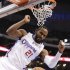 Los Angeles Clippers center Ronny Turiaf celebrates after dunking against the Sacramento Kings during the first half of an NBA basketball game in Los Angeles, Friday, Dec. 21, 2012. (AP Photo/Chris Carlson)
