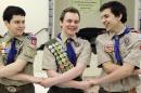 Pascal Tessier ,center, takes part in an activity with Matthew Huerta, left, and Michael Fine, right, after he received his Eagle Scout badge from Troop 52 Scoutmaster Don Beckham, Monday, Feb. 10, 2014, in Chevy Chase, Md. Tessier, of Maryland, has become one of the first openly gay scouts to reach the highest rank of Eagle, following a policy change to allow gay youth in the Boy Scouts of America. (AP Photo/Luis M. Alvarez)