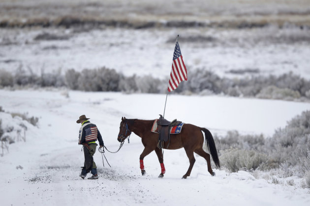 Cowboy Dwane Ehmer, of Irrigon, Ore., a supporter of the group occupying the Malheur National Wildlife Refuge, walks his horse Thursday, Jan. 7, 2016,...