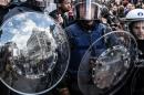 Riot at Brussels attacks shrine; 13 anti-terror raids made