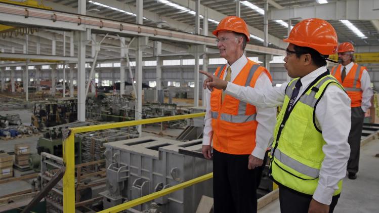 In this Aug. 29, 2013 photo provided by the Alabama Governor&#39;s office, Gov. Robert Bentley, left, listens to Roger Zhang, Golden Dragon U.S.A. President, during a tour of the new Golden Dragon copper tubing plant, then under construction, in Pine Hill, Ala. Golden Dragon, the first company Bentley recruited to Alabama after being elected, will employ 300 new full-time employees in rural Wilcox County. (AP Photo/Alabama Governor&#39;s Office, Jamie Martin)