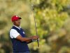 U.S. golfer Tiger Woods hits his tee shot on the 15th hole during the afternoon four-ball round at the 39th Ryder Cup golf matches at the Medinah Country Club