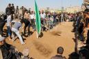 Iraqi Shiite mourners bury members of a pro-Baghdad militia who were killed during clashes with jihadists in Salaheddin province, on March 15, 2015