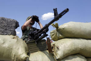 A Ukrainian serviceman uses a pair of binoculars as&nbsp;&hellip;