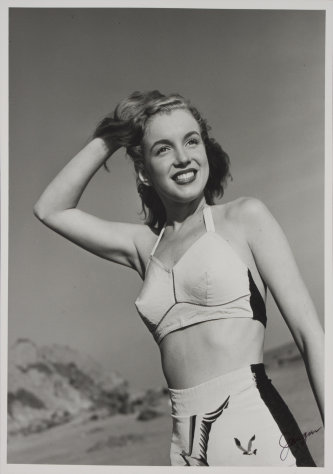 FILE - In this 1946 file image taken by photographer Joseph Jasgur and released by Julien's Auctions, Norma Jean Dougherty, who eventually changed her name to Marilyn Monroe, is shown. Copyrights and images from Marilyn Monroe's first photo shoot sold for $352,000 at Julien's Auctions after a bankruptcy judge in Florida ruled that photos taken of Monroe were to be sold at auction in Dec. 2011 to settle the debts of the photographer. (AP Photo/Julien's Auctions, Joseph Jasgur, File)
