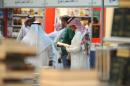 A Saudi man looks at a book during the annual International Book Exhibition in the capital Riyadh on March 4, 2014
