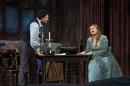 In this photo provided by the Metropolitan Opera, Vittorio Grigolo portrays Rodolfo with Kristine Opolais as Mimi in the Metropolitan Opera's Live in HD broadcast of Puccini's "La Boheme," Saturday, April 5, 2014 in New York. Opolais made Metropolitan Opera history Saturday, stepping in for an ailing soprano to make her second company role debut in a span of 24 hours. On Friday night, Opolais sang Cio-Cio-San in Puccini's "Madama Butterfly." (AP Photo/Metropolitan Opera, Marty Sohl)
