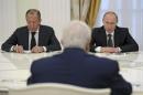 Russian President Putin, Foreign Minister Lavrov and Syrian Foreign Minister Muallem attend a meeting at the Kremlin in Moscow