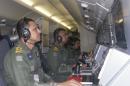 This Sunday, March 23, 2014 photo released by the Indian Navy, shows the navy personnel on board a P-8I aircraft during a search operation for the missing Malaysia Airlines flight MH370 aircraft in the southern Indian Ocean. Ships rushed to the location of floating objects spotted Monday by Australian and Chinese planes in the southern Indian Ocean close to where multiple satellites have detected possible remains of the lost Malaysian airliner. (AP Photo/Indian Navy)