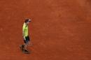 Andy Murray from Britain reacts during a Madrid Open tennis tournament match against Santiago Giraldo from Colombia in Madrid, Spain, Thursday, May 8, 2014. (AP Photo/Andres Kudacki)