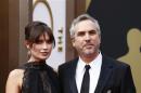 Mexican director Cuaron and his partner Goldsmith arrive at the 86th Academy Awards in Hollywood