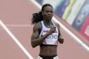 Botswana's Amantle Montsho wins her heat of the women's 400m at Hampden Park during the Commonwealth Games in Glasgow on July 27, 2014