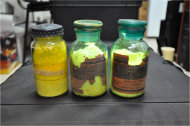This undated handout photo provided by the Georgia Interior Ministry shows bottles containing one kilogram (2.2 pounds) of yellowcake uranium. Police said they seized the nuclear material from a group of five in Samtredia, Georgia on April 5, 2012. The lightly processed substance can be enriched into bomb-grade material. The extent of the black market is unknown, but a steady stream of attempted sales of radioactive materials in recent years suggests smugglers have sometimes crossed borders undetected. (AP Photo/Georgia Interior Ministry)