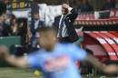 Inter Milan coach Walter Mazzarri touches his head reacting during a Serie A soccer match between Inter Milan and Napoli, at the San Siro stadium in Milan, Italy, Saturday, April 26, 2014. (AP Photo/Luca Bruno)