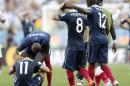 France's Rio Mavuba walks off the pitch with his teammate Mathieu Valbuena (8) after Germany defeated France 1-0 to advance to the semifinals during the World Cup quarterfinal soccer match at the Maracana Stadium in Rio de Janeiro, Brazil, Friday, July 4, 2014. Left is France's Eliaquim Mangala and Antoine Griezmann. (AP Photo/Matthias Schrader)