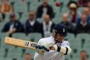 England's Graeme Swann bats against Australia during the last day of the second Ashes cricket Test match in Adelaide on December 9, 2013