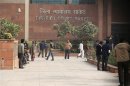People arrive at a district court in New Delhi