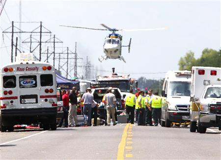 A Medevac helicopter lands at a triage center set up on highway LA 3115 near the Williams Olefins chemical plant, after an explosion and fire there, in Geismar