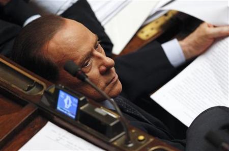 Former Italian Prime Minister Silvio Berlusconi looks on during a vote of confidence at the Lower House of Parliament in Rome November 18, 2011. REUTERS/Tony Gentile