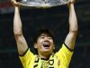Borussia Dortmund Kagawa celebrates with the German championship trophy after defeating Bayern Munich to win the German DFB Cup (DFB Pokal) final soccer match at the Olympic stadium in Berlin