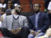 Miami Heat's LeBron James, left, and Dwyane Wade sit on the bench during the first half of an NBA basketball game against the Washington Wizards on Wednesday, April 10, 2013, in Washington. (AP Photo/Evan Vucci)