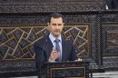 Syria's President Bashar al-Assad delivers a speech to Syria's parliament in Damascus