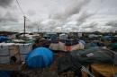 France had planned to move 500 to 700 migrants and refugees out of the grim makeshift camp in Calais known as "The Jungle" into refitted containers with heaters, electricity plugs and cribs for newborns