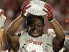 Alabama's Eddie Lacy holds up the championship trophy after the BCS National Championship college football game against Notre Dame Monday, Jan. 7, 2013, in Miami. Alabama won 42-14. (AP Photo/Chris O'Meara)