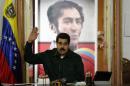 Venezuela's President Nicolas Maduro gestures during a meeting with the opposition's newly elected mayors and governors at Miraflores Palace in Caracas