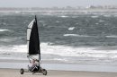 A person rides in a cart blown by the winds along the Altlantic Ocean in North Wildwood, N.J., Saturday, Oct. 27, 2012, as the winds pick up ahead of Hurricane Sandy. From the lowest lying areas of the Jersey shore, where residents were already being encouraged to leave, to the state's northern highlands, where sandbags were being filled and cars moved into parking lots on high ground, New Jersey began preparing in earnest for Hurricane Sandy. (AP Photo/Mel Evans)