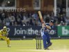 England's Morgan hits out watched by Australia's Wade during the first one-day international at Lord's cricket ground in London