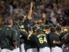 Oakland Athletics players celebrate after earning a wild card berth in Oakland