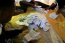 Rwanda election officials count votes as polling closes after Rwandans voted during a referendum to amend its Constitution to allow President Paul Kagame to seek a third term during next year presidential election in Rwanda's capital Kigali