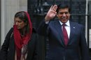 Pakistan's Prime Minister Raja Pervez Ashraf leaves with Foreign Minister Hina Rabbani Khar after their meeting with David Cameron at 10 Downing Street in London