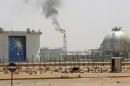 Gas flame is seen in the desert near the Khurais oilfield
