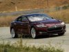 A Tesla Model S electric sedan is driven near the company's factory in Fremont