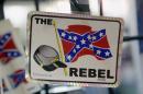 Confederate flag themed stickers are displayed at Arkansas Flag and Banner in Little Rock, Ark., Tuesday, June 23, 2015. Major retailers including Amazon, Sears, eBay and Etsy and Wal-Mart Stores Inc., are halting sales of the Confederate flag and related merchandise. (AP Photo/Danny Johnston)